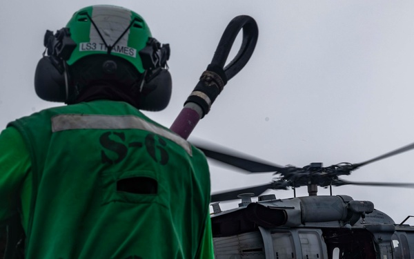 Abraham Lincoln conducts a replenishment-at-sea with Henry J. Kaiser and Cesar Chavez