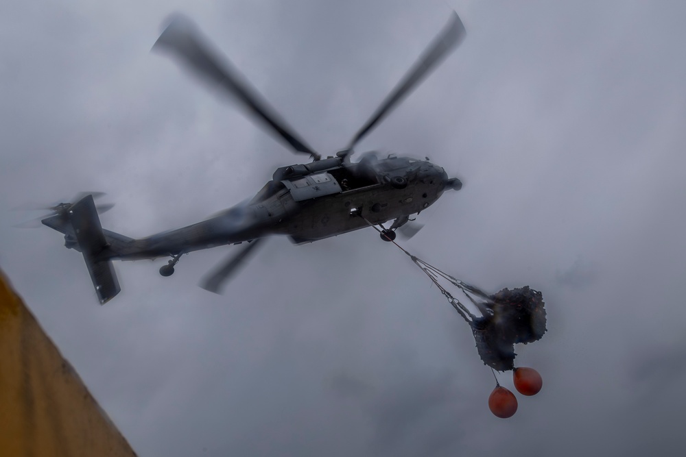 Abraham Lincoln conducts a replenishment-at-sea with Henry J. Kaiser and Cesar Chavez