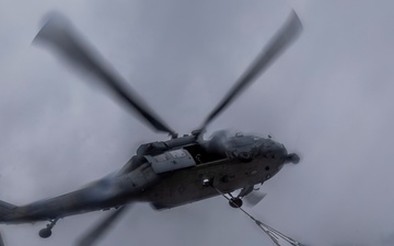 Abraham Lincoln conducts a replenishment-at-sea with Henry J. Kaiser and Cesar Chavez