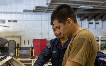 Abraham Lincoln conducts routine maintenance