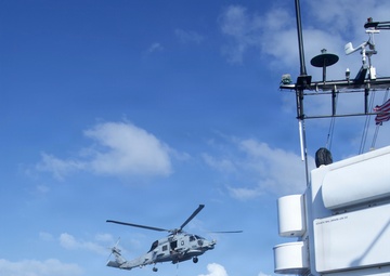Coast Guard Cutter Bear, U.S. Navy aircrews conduct vertical replenishment operations in the Caribbean Sea