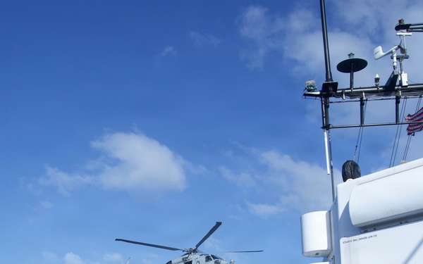 Coast Guard Cutter Bear, U.S. Navy aircrews conduct vertical replenishment operations in the Caribbean Sea