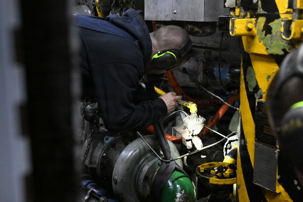 USCGC Polar Star (WAGB 10) main propulsion crew members conduct maintenance during Operation Deep Freeze 2026