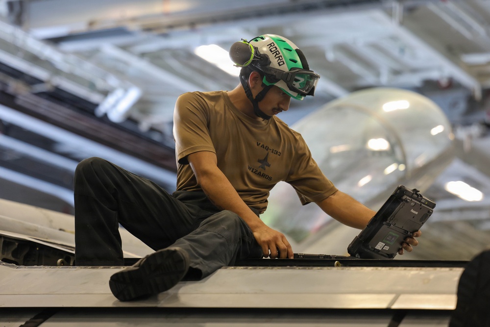 Abraham Lincoln conducts routine aircraft maintenance