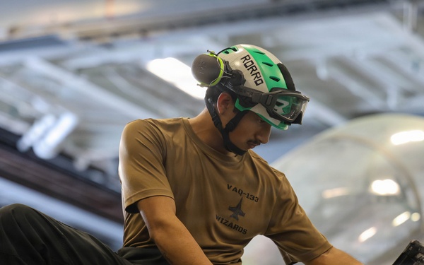 Abraham Lincoln conducts routine aircraft maintenance