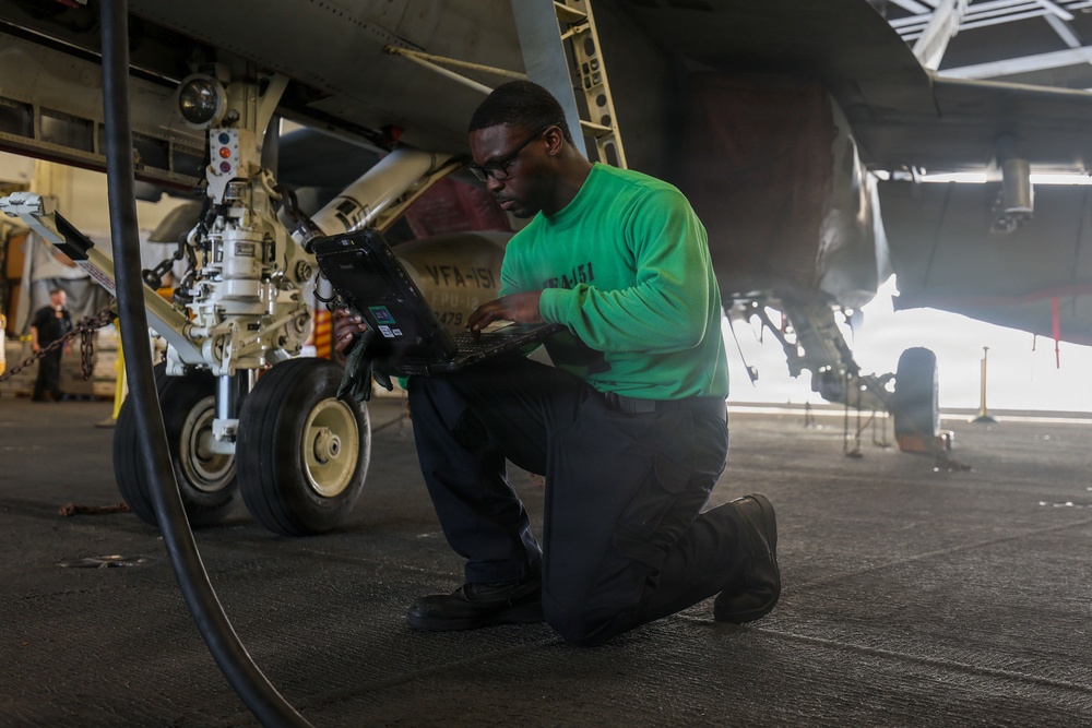 Abraham Lincoln conducts routine aircraft maintenance