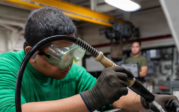 Abraham Lincoln conducts routine maintenance