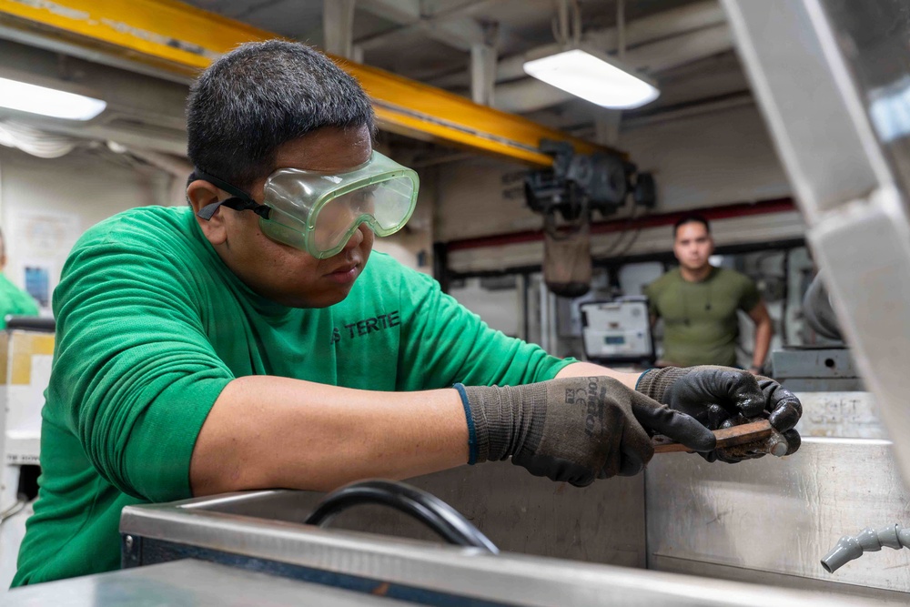 Abraham Lincoln conducts routine maintenance