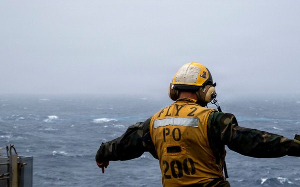 Abraham Lincoln conducts a replenishment-at-sea with Cesar Chavez