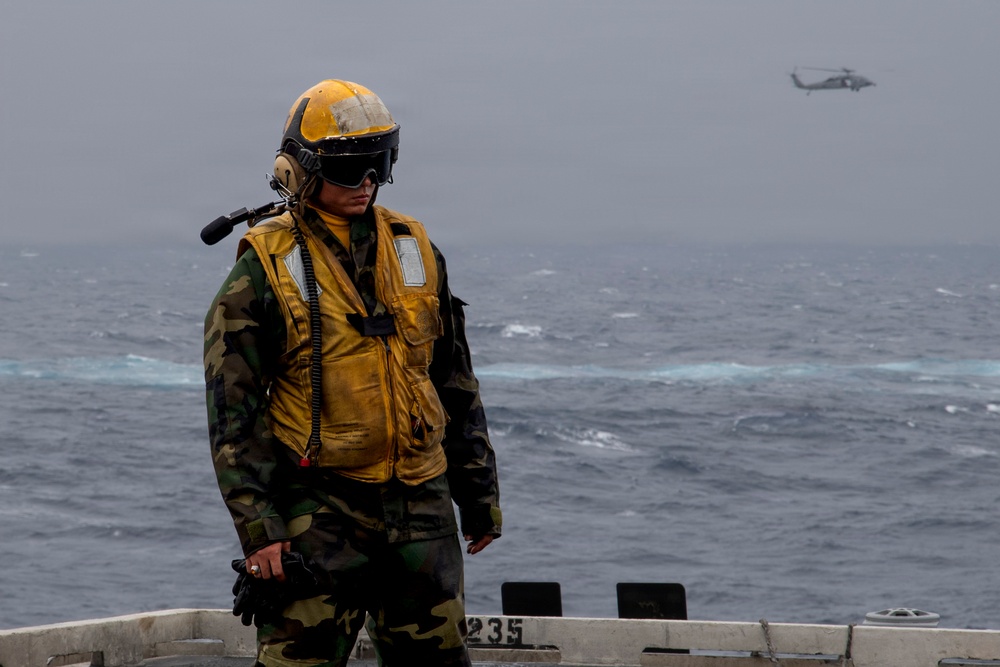 Abraham Lincoln conducts a replenishment-at-sea with Cesar Chavez