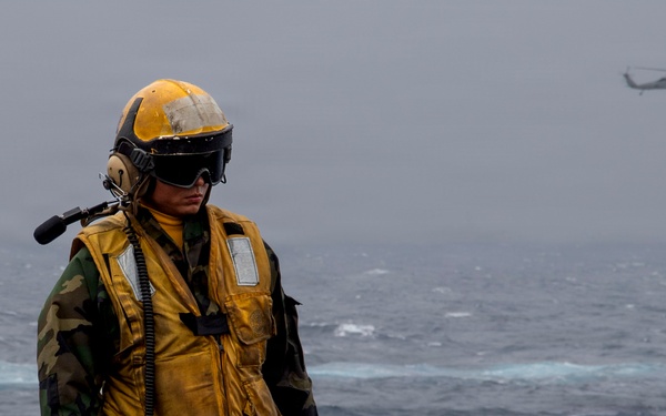 Abraham Lincoln conducts a replenishment-at-sea with Cesar Chavez