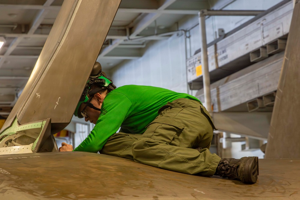 Abraham Lincoln conducts routine aircraft maintenance