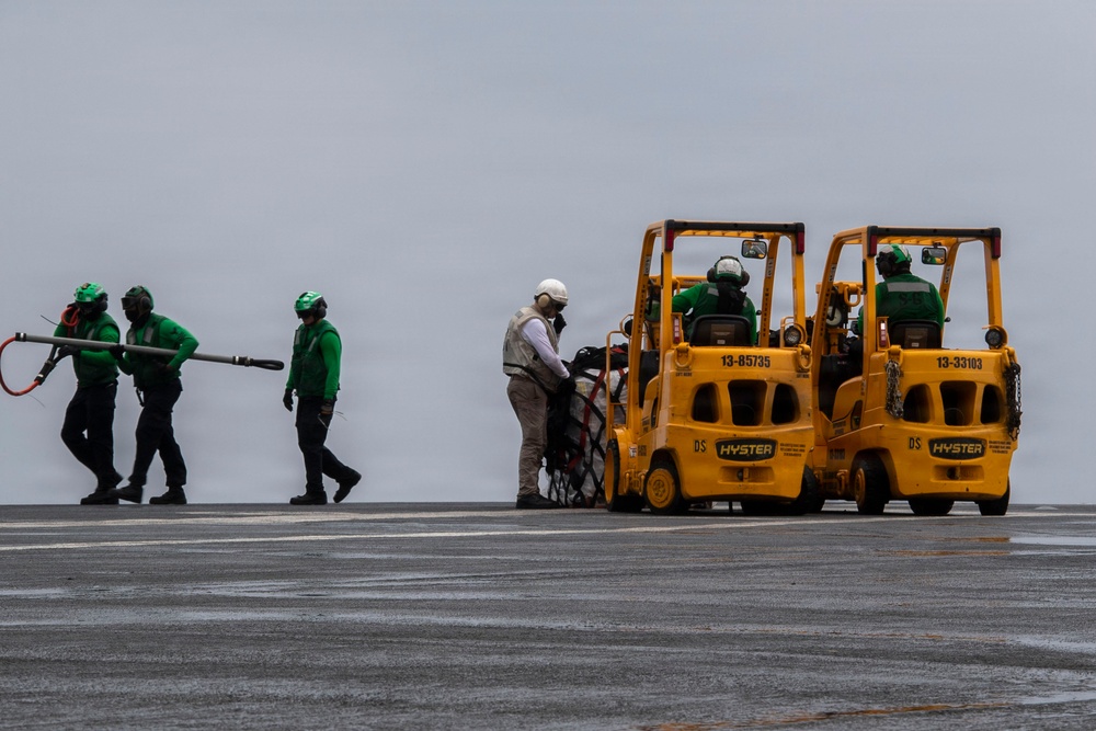 Abraham Lincoln conducts a replenishment-at-sea with Cesar Chavez