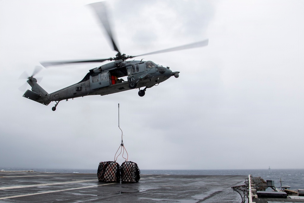 Abraham Lincoln conducts a replenishment-at-sea with Cesar Chavez