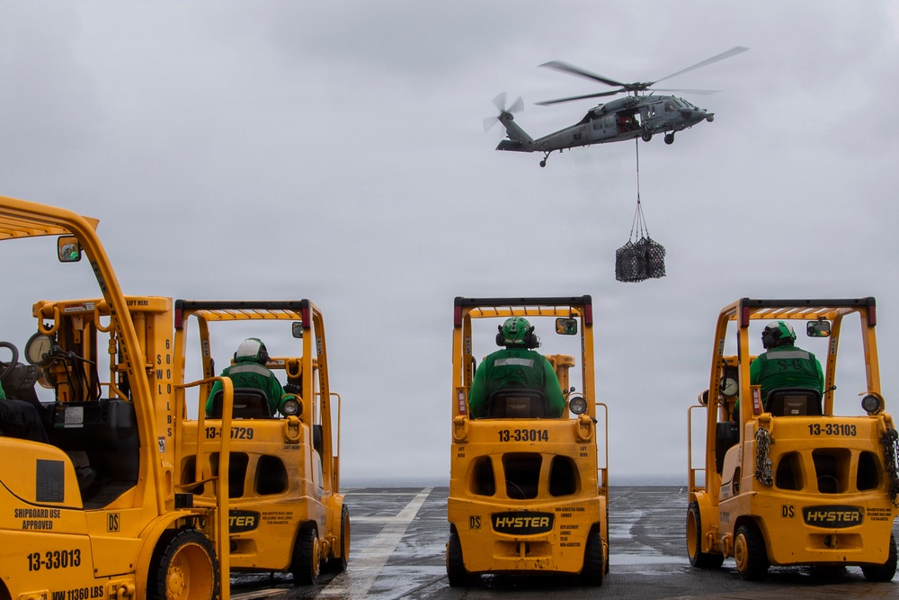 Abraham Lincoln conducts a replenishment-at-sea with Cesar Chavez