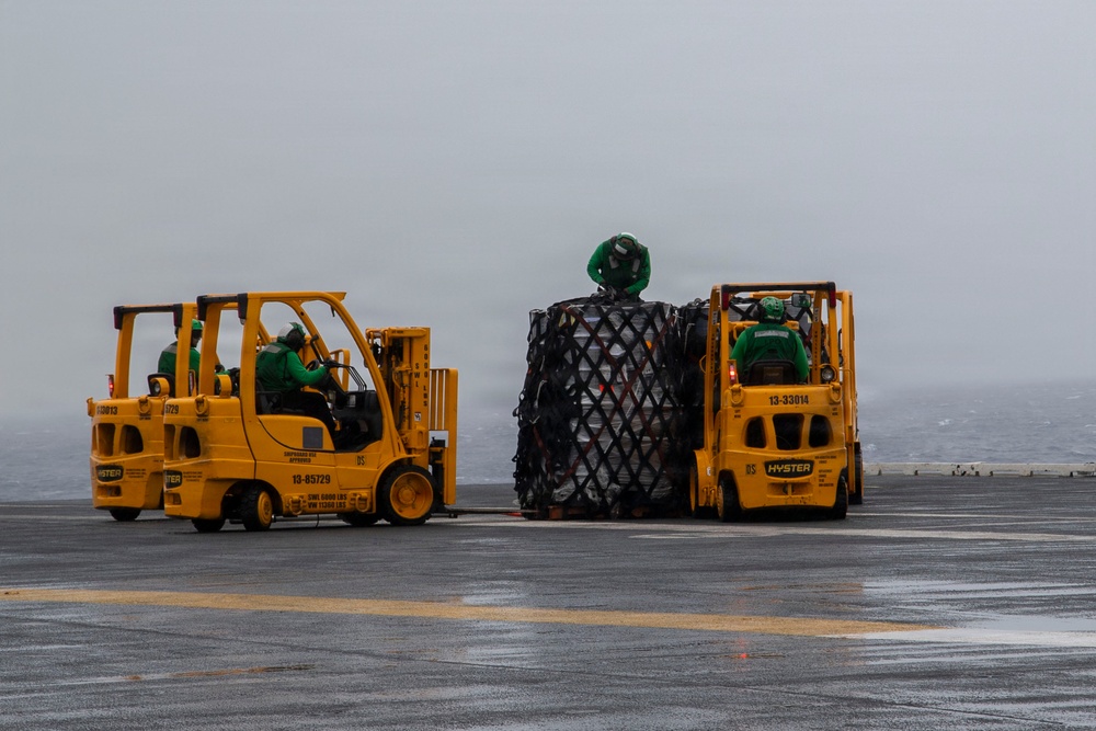 Abraham Lincoln conducts a replenishment-at-sea with Cesar Chavez