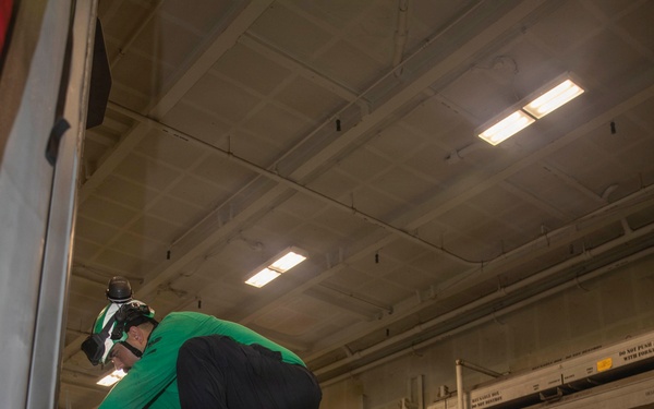 Abraham Lincoln conducts routine aircraft maintenance