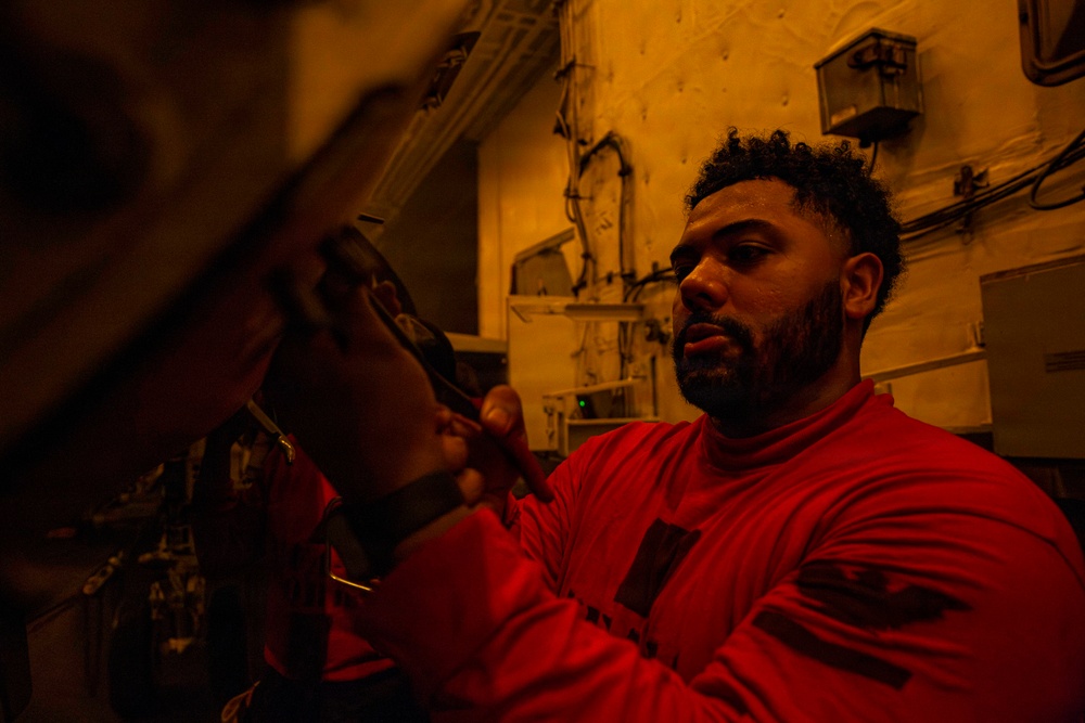 Abraham Lincoln conducts routine aircraft maintenance