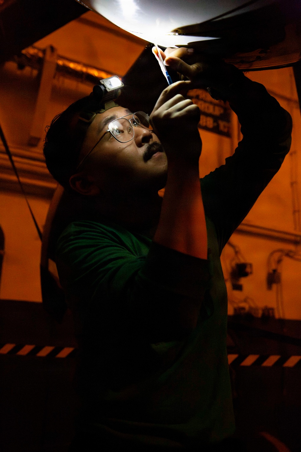 Abraham Lincoln conducts routine aircraft maintenance