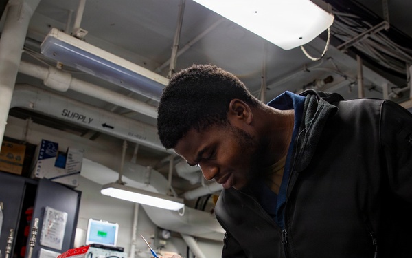 Abraham Lincoln conducts routine maintenance