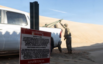 Soldiers place NDA 5 signs