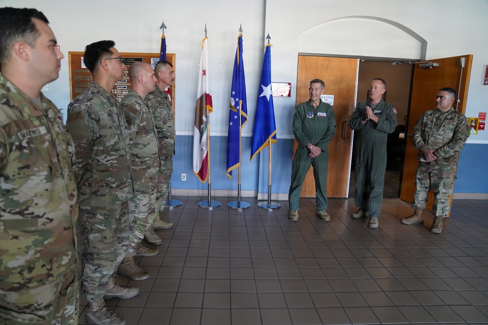 Maj. Gen. Steven Butow Coins Outstanding Airmen of the Year Winners