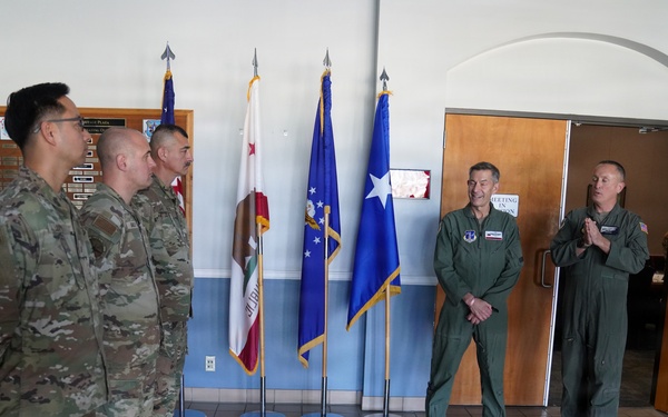 Maj. Gen. Steven Butow Coins Outstanding Airmen of the Year Winners