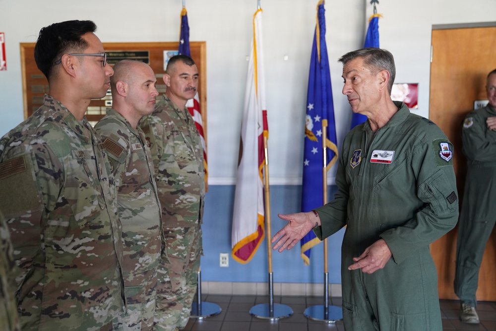 Maj. Gen. Steven Butow Coins Outstanding Airmen of the Year Winners