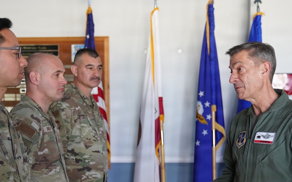 Maj. Gen. Steven Butow Coins Outstanding Airmen of the Year Winners