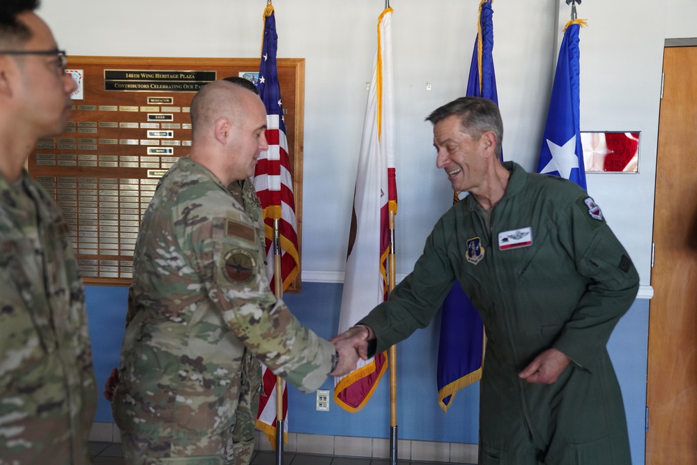 Maj. Gen. Steven Butow Coins Outstanding Airmen of the Year Winners