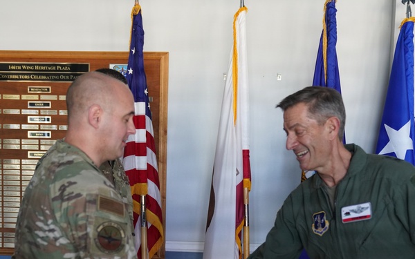 Maj. Gen. Steven Butow Coins Outstanding Airmen of the Year Winners