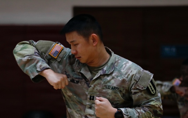 1st Signal Brigade soldiers take a Taekwondo yellow belt promotion test