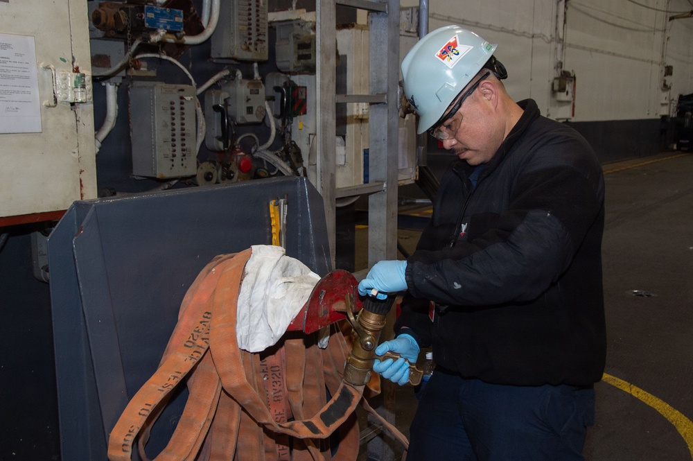 Ronald Reagan Sailors and Contractors Perform Maintenance
