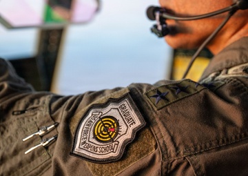 Gen. Spain leads from the cockpit during HC-130J flight at Nellis AFB