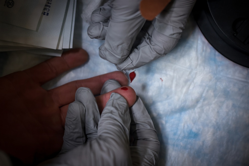 U.S. Marines volunteer at Camp Hansen Blood Drive