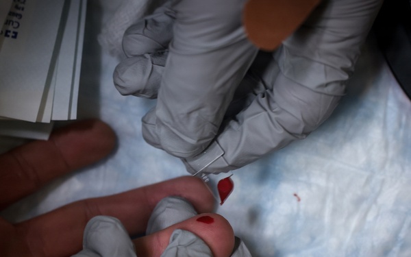 U.S. Marines volunteer at Camp Hansen Blood Drive