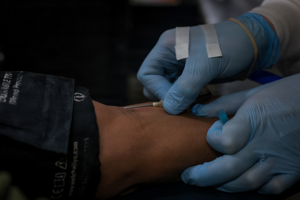 U.S. Marines volunteer at Camp Hansen Blood Drive
