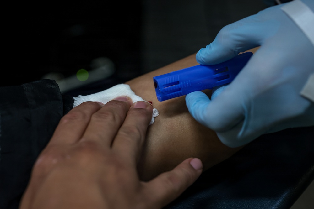 U.S. Marines volunteer at Camp Hansen Blood Drive