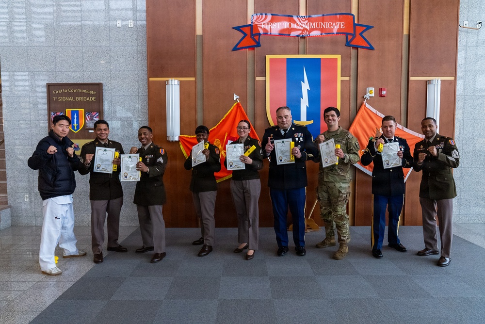 1st Signal Brigade HHC conducts taekwondo yellow belt promotion and recognition