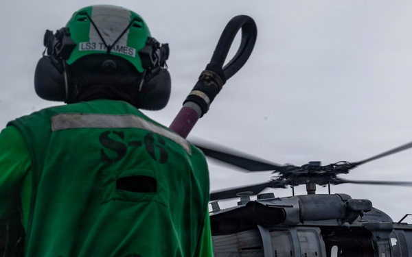 Abraham Lincoln conducts a replenishment-at-sea with Henry J. Kaiser and Cesar Chavez