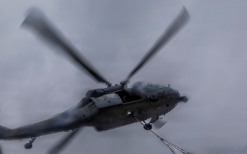Abraham Lincoln conducts a replenishment-at-sea with Henry J. Kaiser and Cesar Chavez