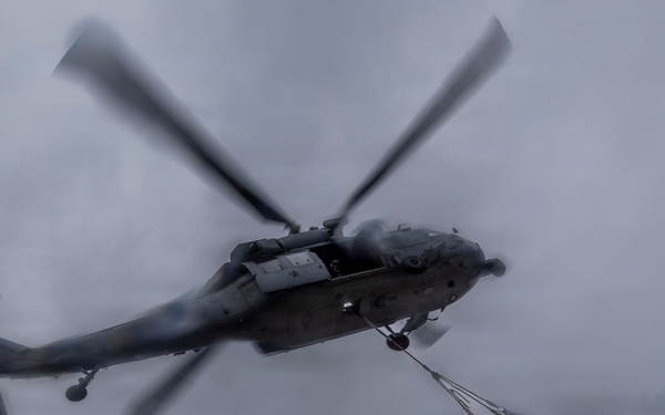 Abraham Lincoln conducts a replenishment-at-sea with Henry J. Kaiser and Cesar Chavez