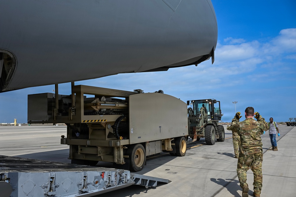 449th AEG Airmen support regional mobility operations through cargo offload