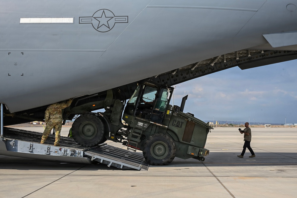 449th AEG Airmen support regional mobility operations through cargo offload