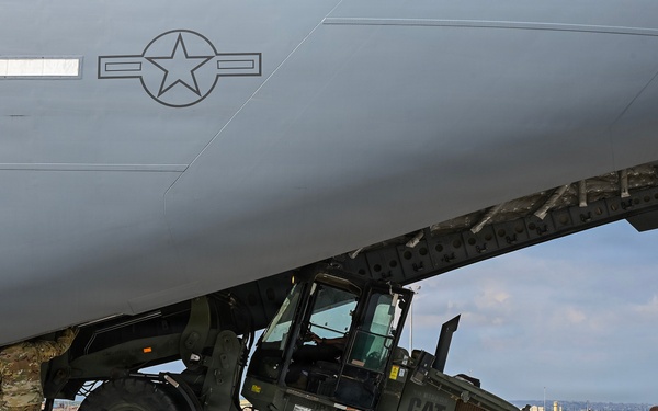 449th AEG Airmen support regional mobility operations through cargo offload