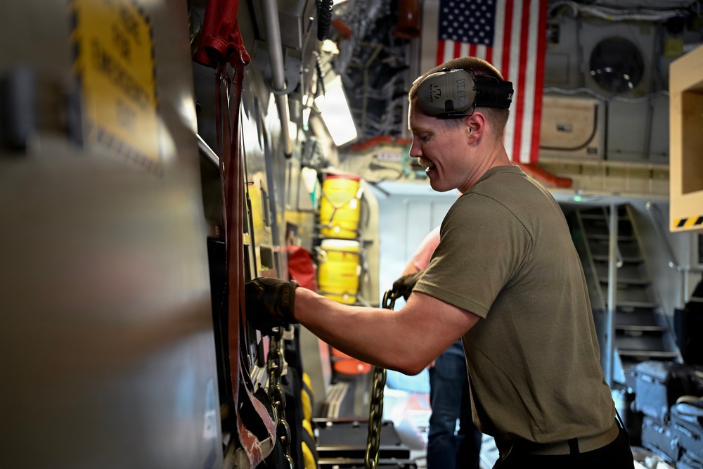 449th AEG Airmen support regional mobility operations through cargo offload