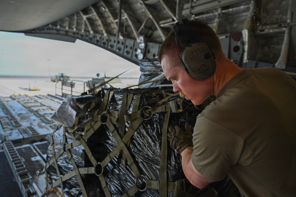 449th AEG Airmen support regional mobility operations through cargo offload