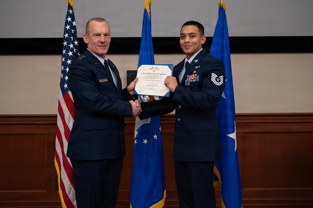 Boom operator assigned to the 91st Aircraft Maintenance Squadron, Tech. Sgt. Alex Diego, presented with Distinguished Flying Cross