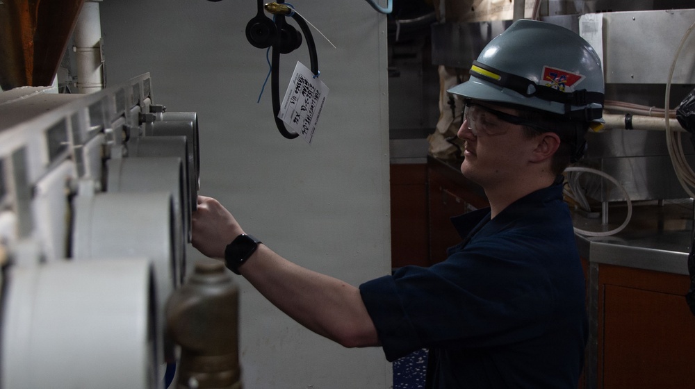 Ronald Reagan Sailors and Contractors Perform Maintenance