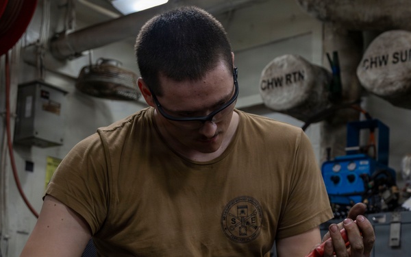 Abraham Lincoln conducts routine maintenance